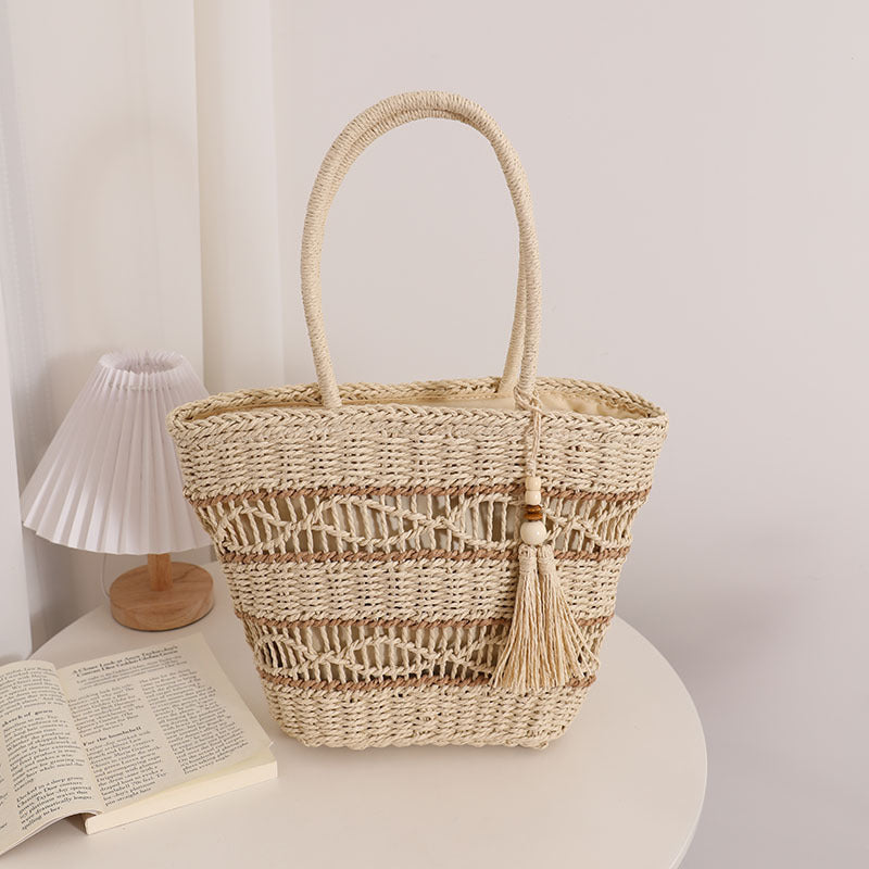 Handcrafted straw tote bag with decorative tassel detail Stornfield