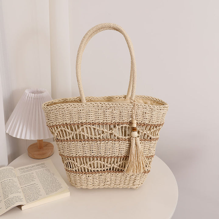 Handcrafted straw tote bag with decorative tassel detail Stornfield