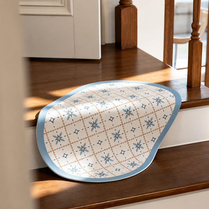 Oval wipeable placemat with embossed tulip pattern and non-slip underside Stornfield