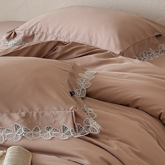 Luxurious cotton satin bed linen set with fine lace border