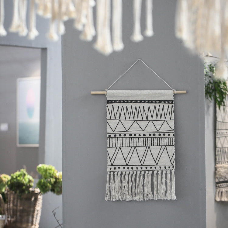 Woven Boho wall hanging with fringes and graphic ethnic pattern Stornfield