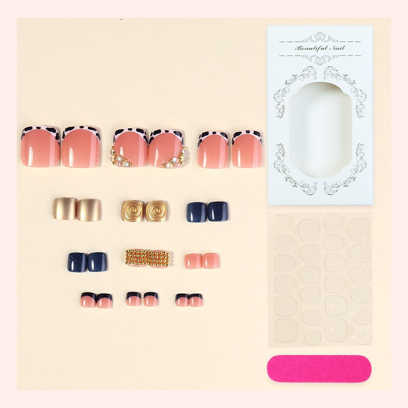Acrylic nail set with luxurious golden embellishments Stornfield