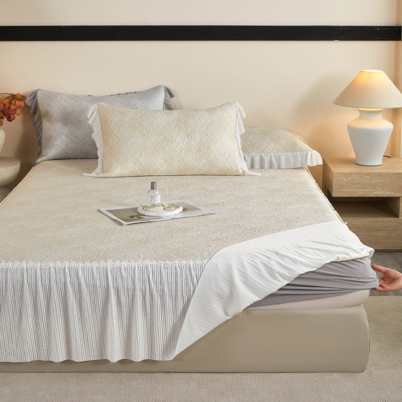 Reversible mattress protector with pleated ruffle and microfiber velvet surface