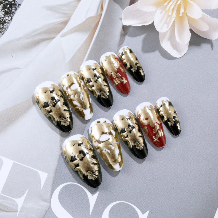 Elegant artificial nails with gold and black pattern Stornfield