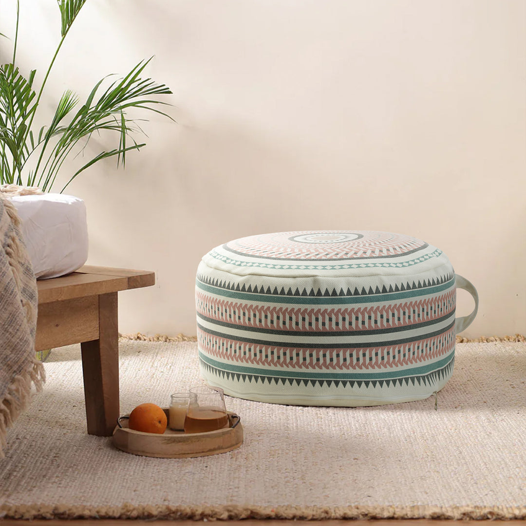 Round padded floor seat pouf with woven ethnic pattern and carrying handle Stornfield