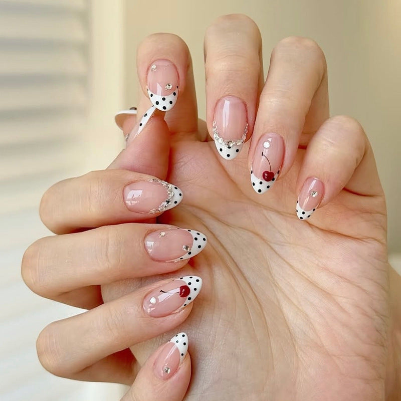 Acrylic nail set with polka-dotted accents and sparkling details Stornfield