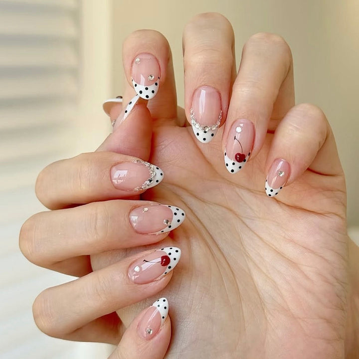 Acrylic nail set with polka-dotted accents and sparkling details Stornfield