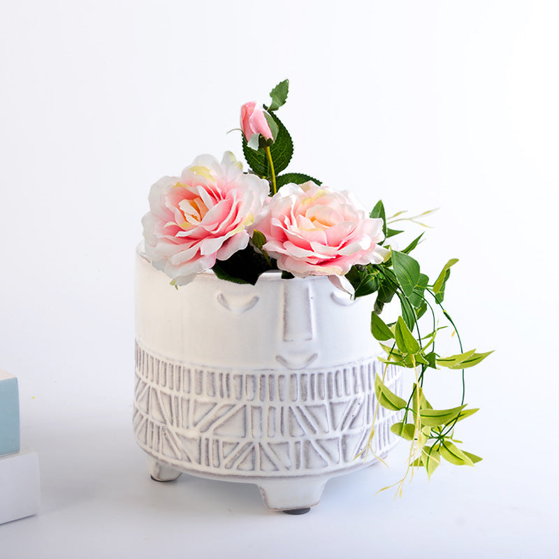 Decorative plant pot with facial features Stornfield