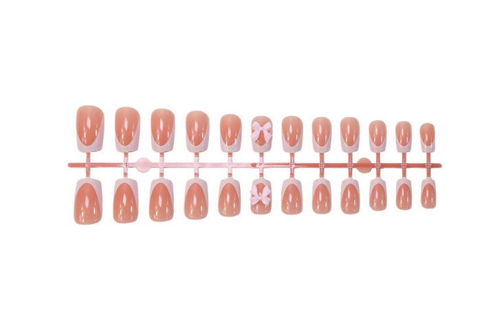 Acrylic nail set with elegant tips and playful bows Stornfield