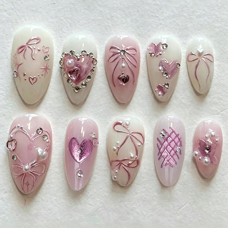 Artificial nail set with romantic bow and heart designs Stornfield
