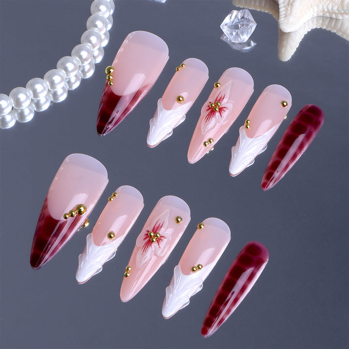 Artificial Nails in Elegant Modern Stiletto Style with Floral Design and Golden Accents Stornfield