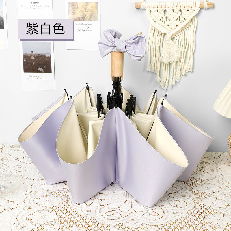Ladies elegant folding umbrella in portrait format with stylish wooden handle Stornfield