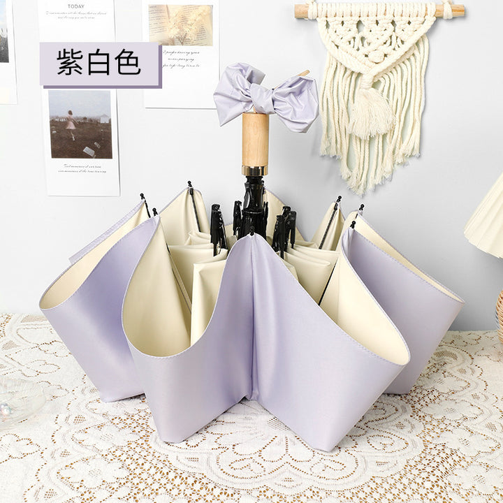 Ladies elegant folding umbrella in portrait format with stylish wooden handle Stornfield