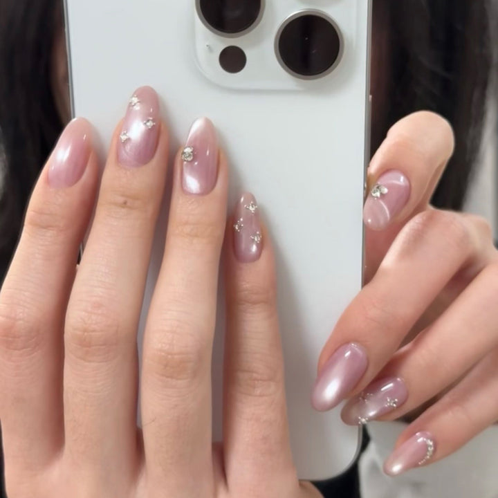 Artificial nail art with glitter embellishments Stornfield