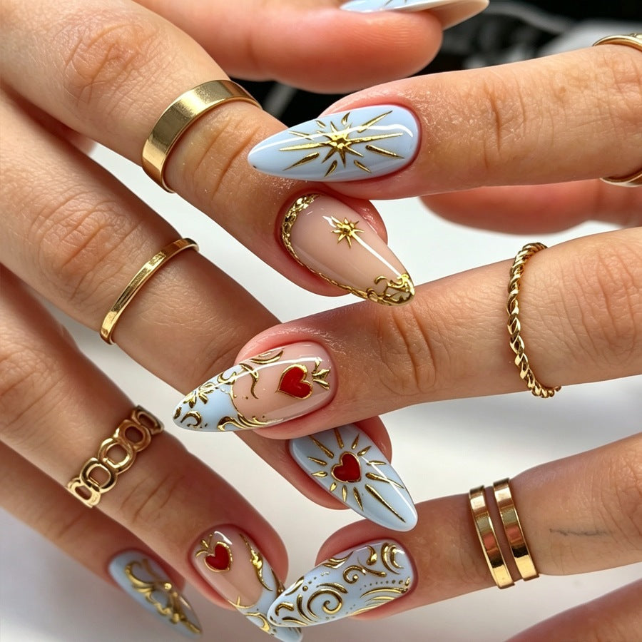 Artificial nail set with filigree golden accents and romantic heart motifs Stornfield