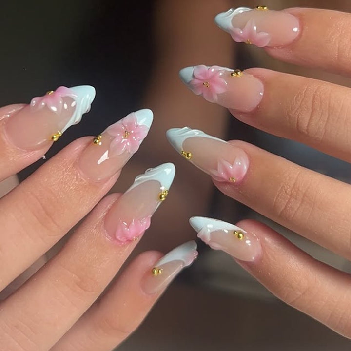 Creative nail art set with delicate flower design and glitter accents Stornfield
