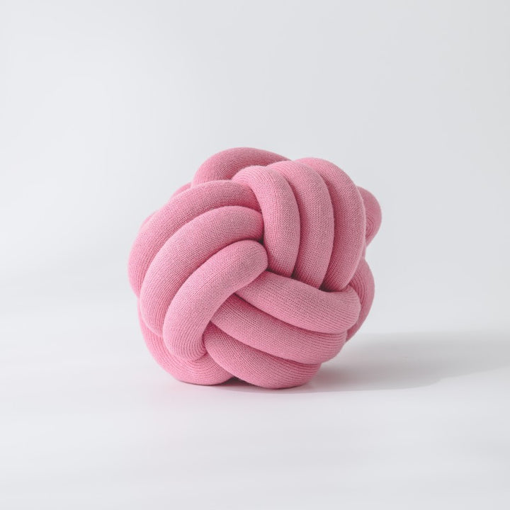 Decorative knitted knot cushion as a decorative pillow made of soft jersey