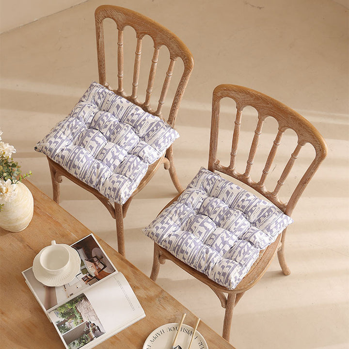 Padded quilted seat cushion with colorful button applications and non-slip underside Stornfield