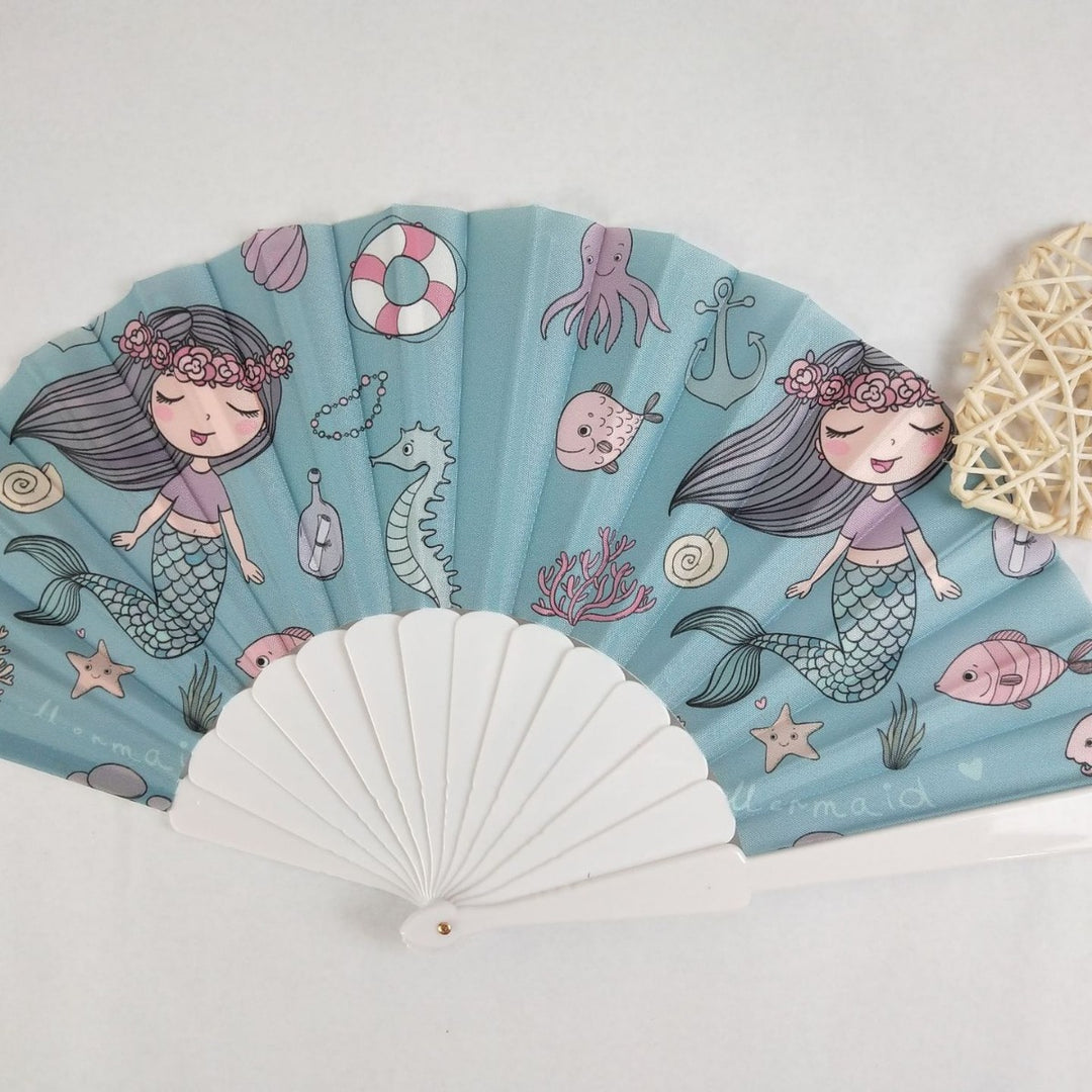 Women folding hand fan with shimmering scale pattern Stornfield