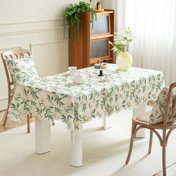 Round wipeable tablecloth with floral cut-out hem Stornfield