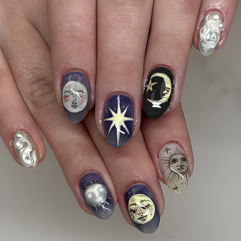 Artificial nail set with heavenly motifs and glamorous details Stornfield