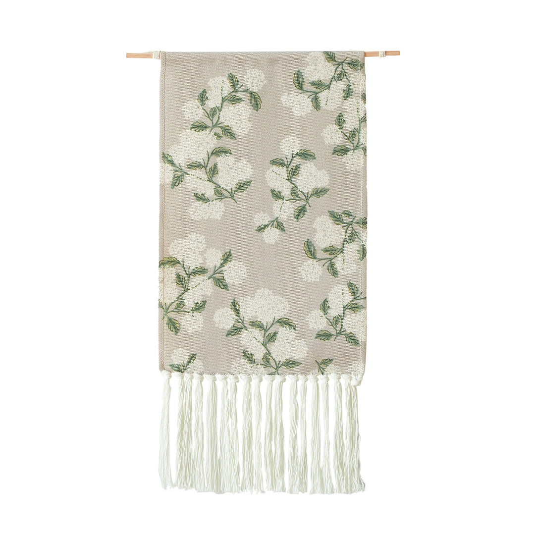 Woven wall tapestry with hydrangea pattern and long fringes