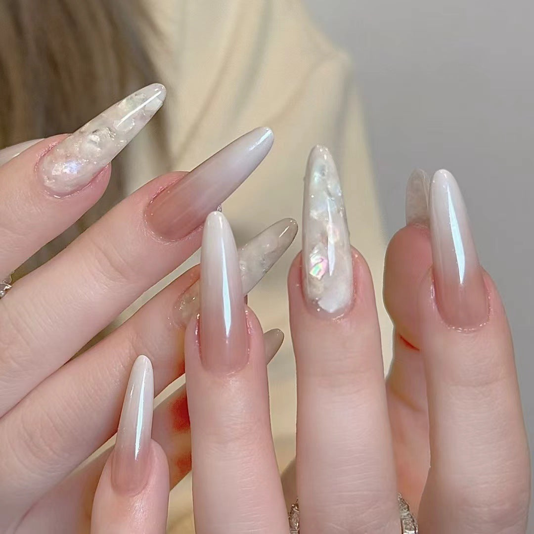 Glamorous Stiletto Nail Extensions with Decorative Accents