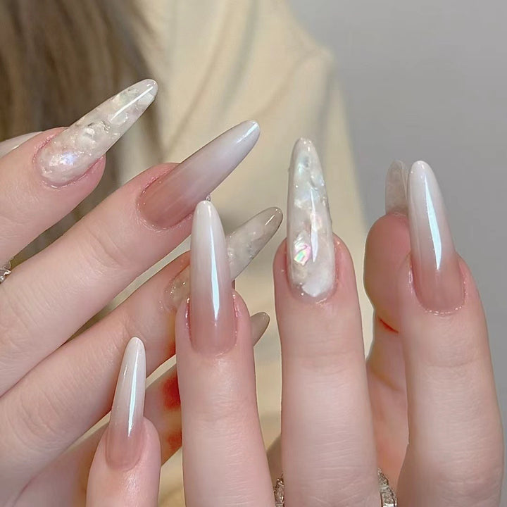 Glamorous Stiletto Nail Extensions with Decorative Accents