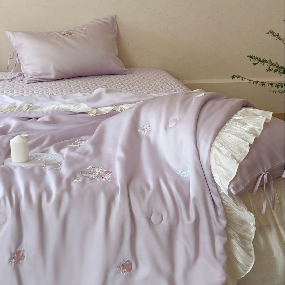 Romantic satin bedding set with ruffle, floral embroidery and tie pillow