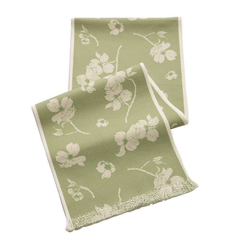 Woven table runner with floral jacquard pattern and fringed edge Stornfield