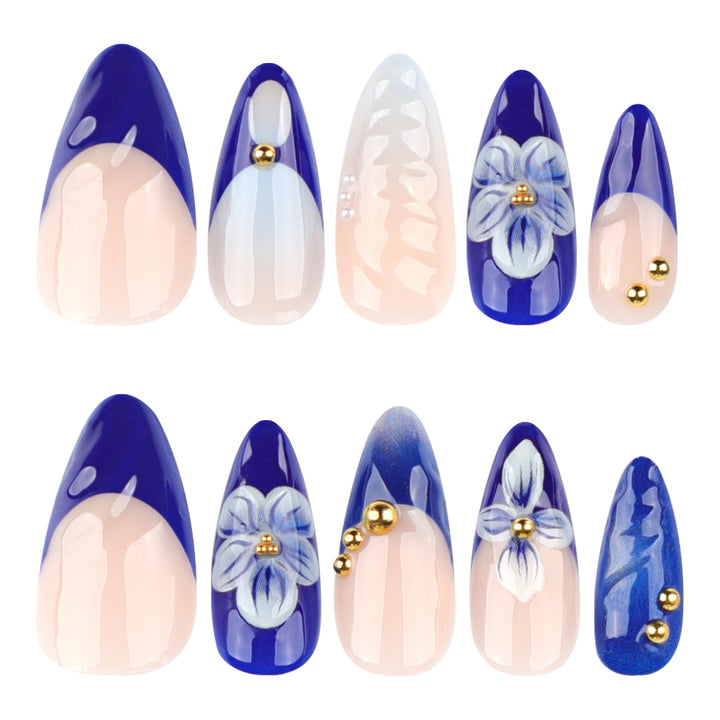 Artistic nail art with floral accents and glitter embellishments Stornfield