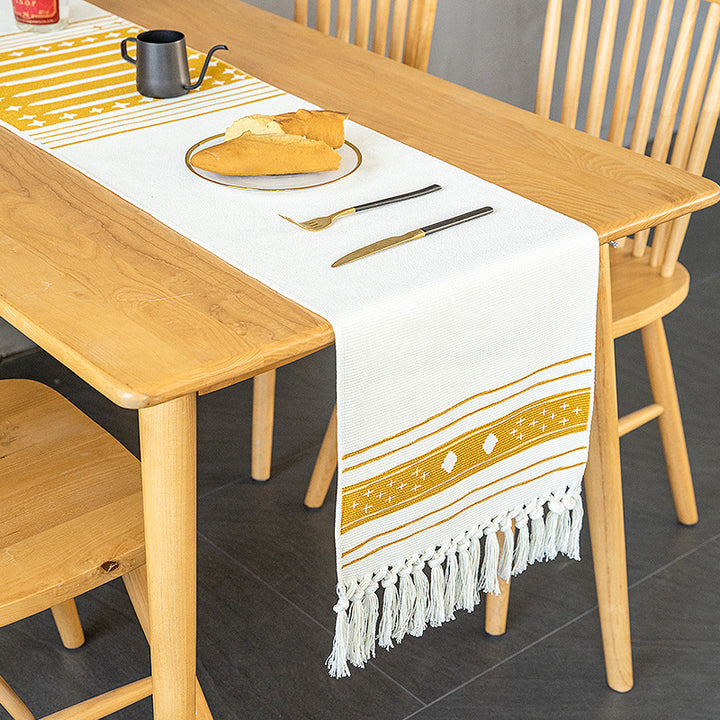 Woven Boho table runner made of cotton blend with decorative fringes and graphic stripe pattern Stornfield