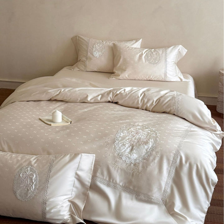 Luxurious cotton satin bedding set with embroidered medallion appliqués and lace trim