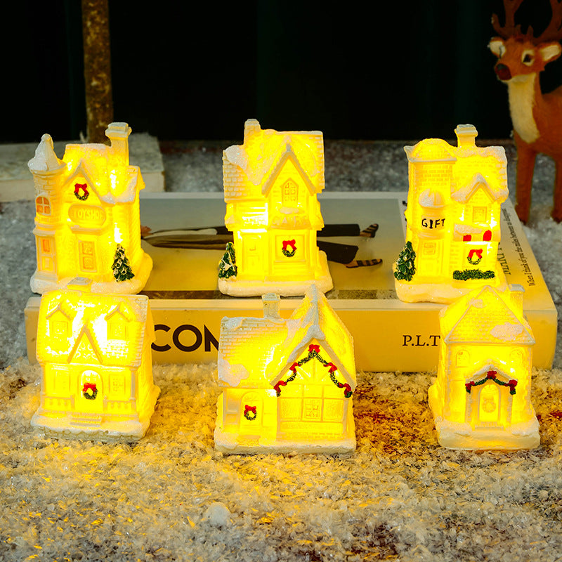 Illuminated Christmas village house with festive decoration Stornfield