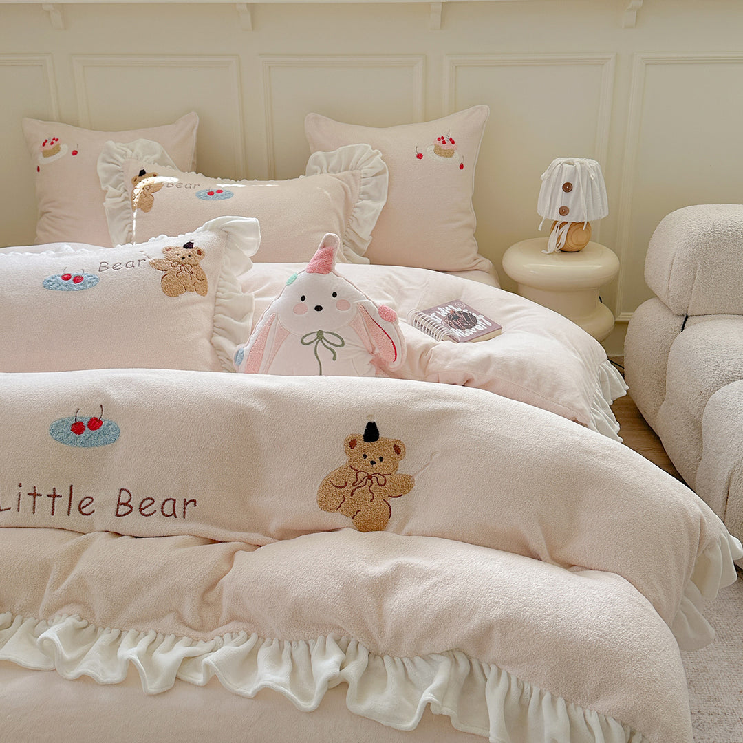 Bedding set with plush surface, ruffled hem and cute embroidery designs
