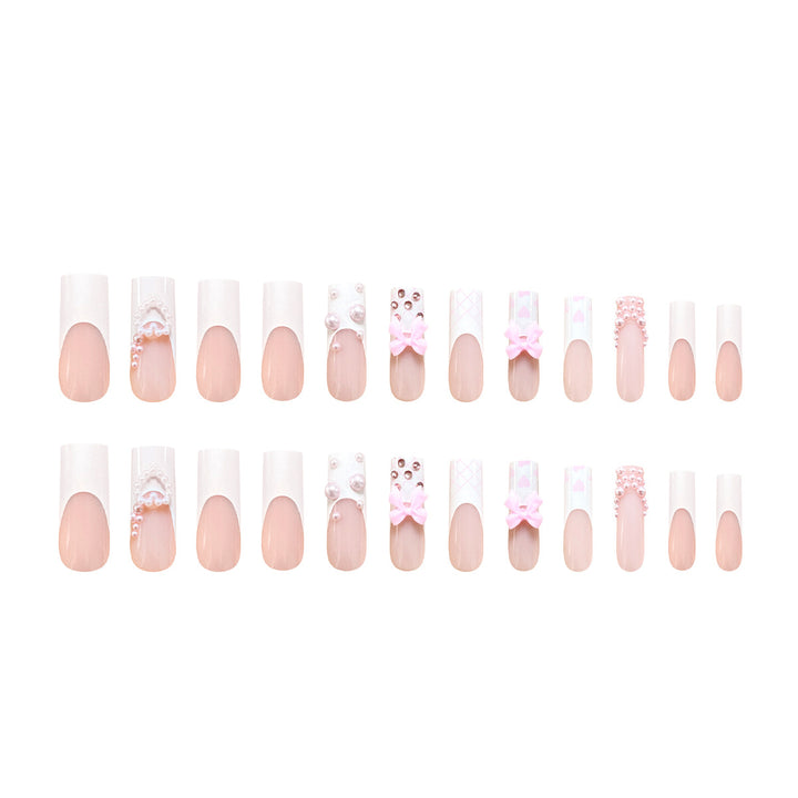 Artistic acrylic nails with bow and pearl decorations Stornfield