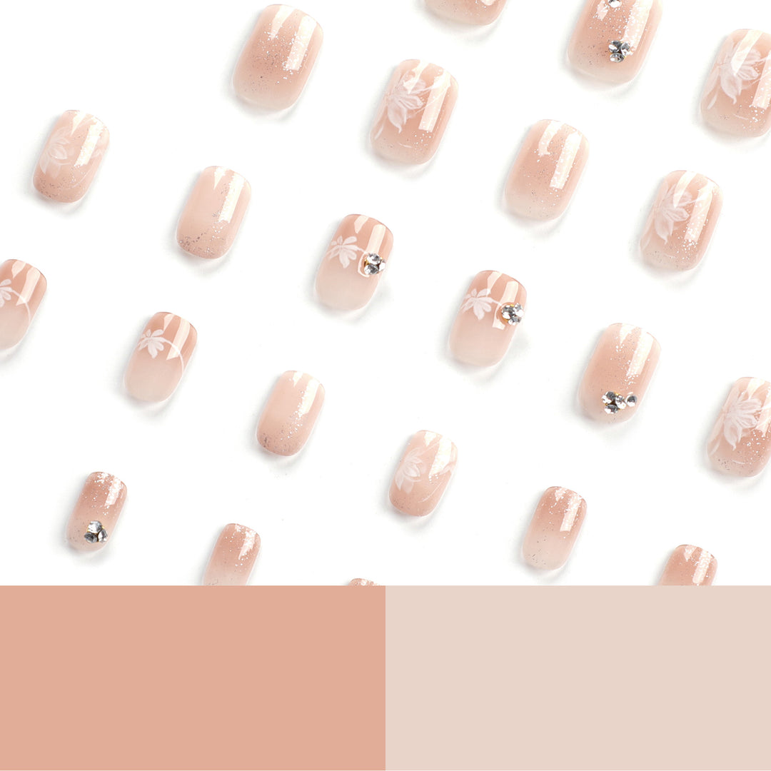 Elegant Nail Art with Holographic Accents and Floral Embellishments Stornfield
