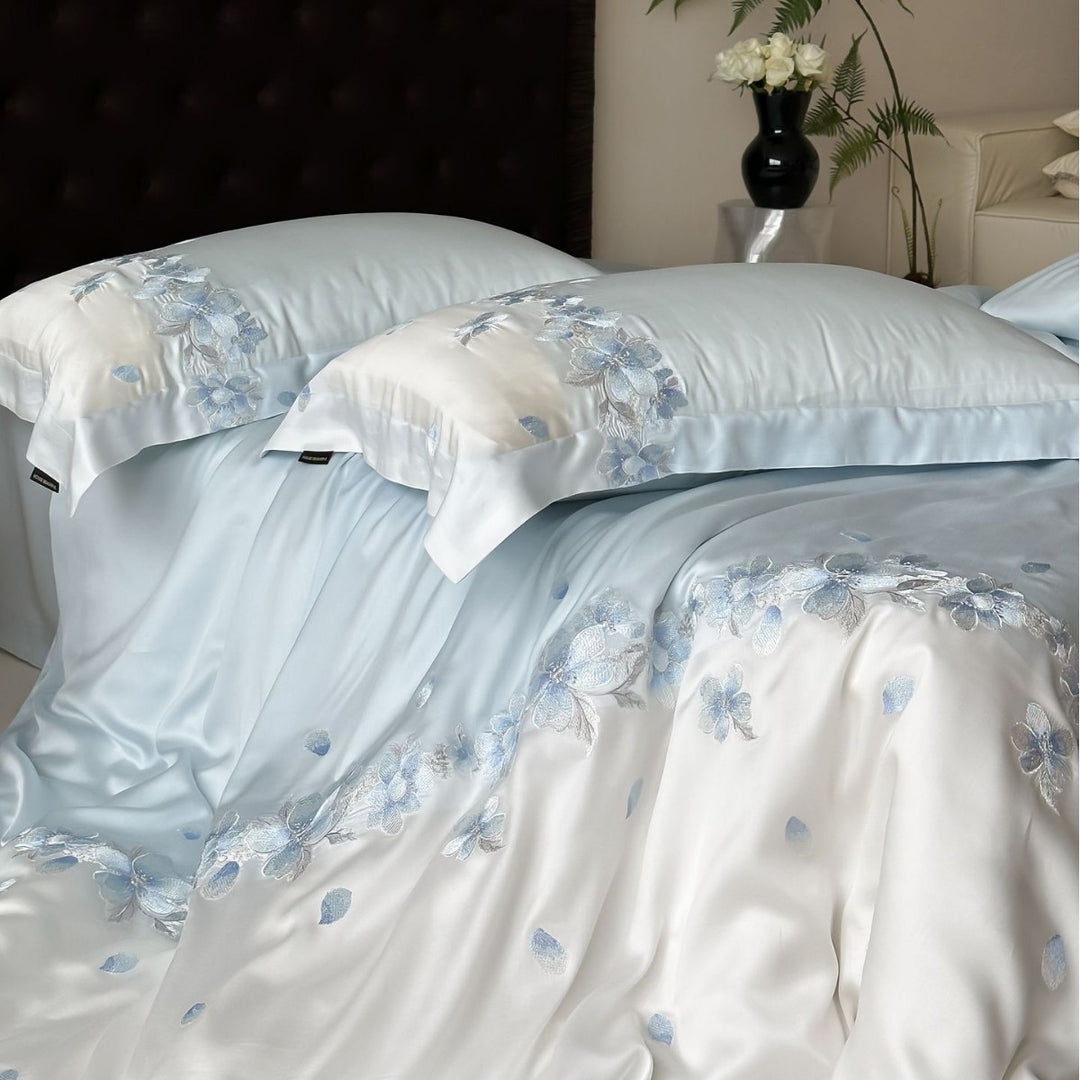 Luxurious satin bedding set with floral embroidery border and silky shine surface