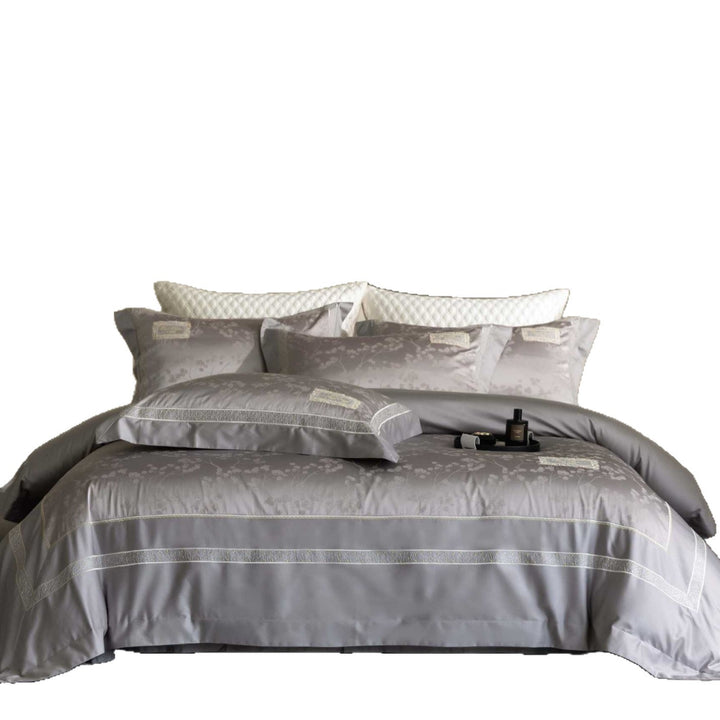 Luxurious satin bedding with jacquard floral pattern and lace trim