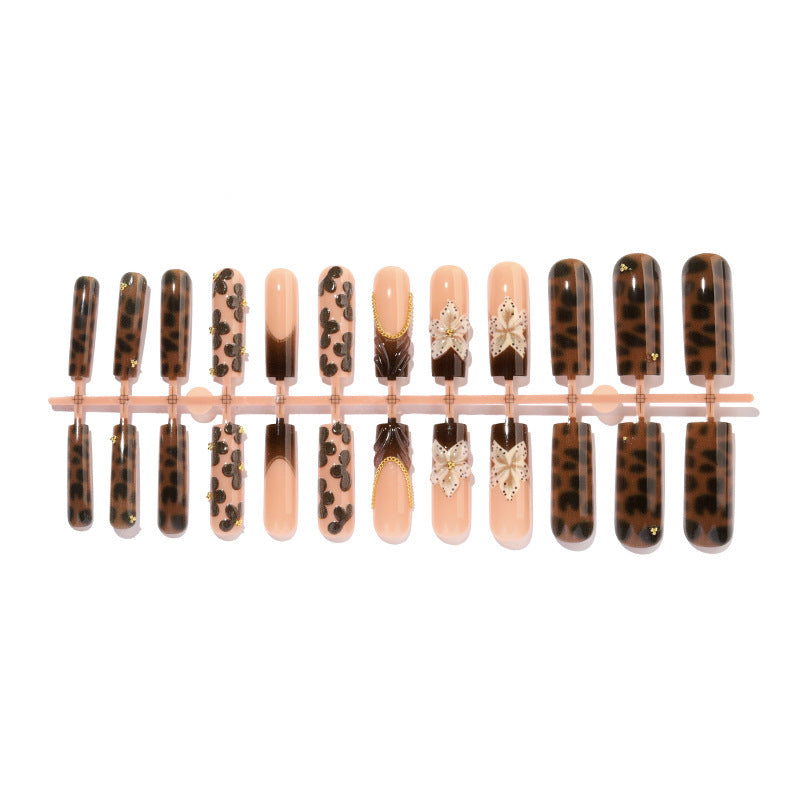 Creative nail art set with glamorous animal motifs and elegant embellishments Stornfield