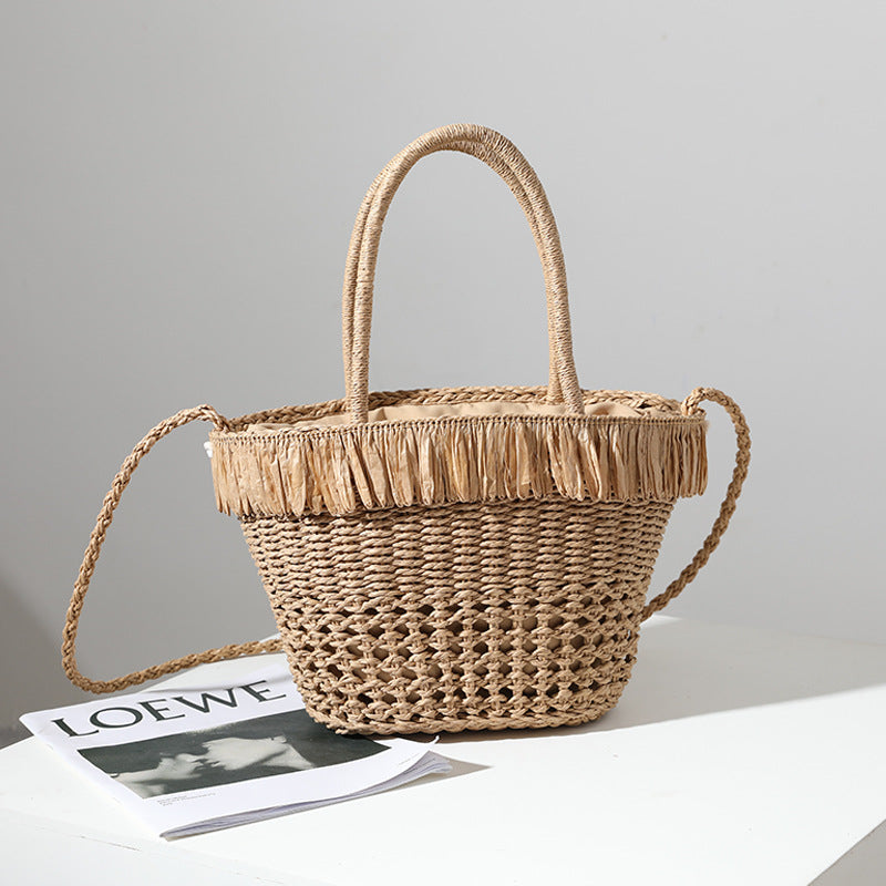 Braided straw bag with decorative tassel detail Stornfield