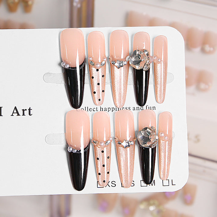 Artificial nail set with elegant glitter and 3D applications Stornfield
