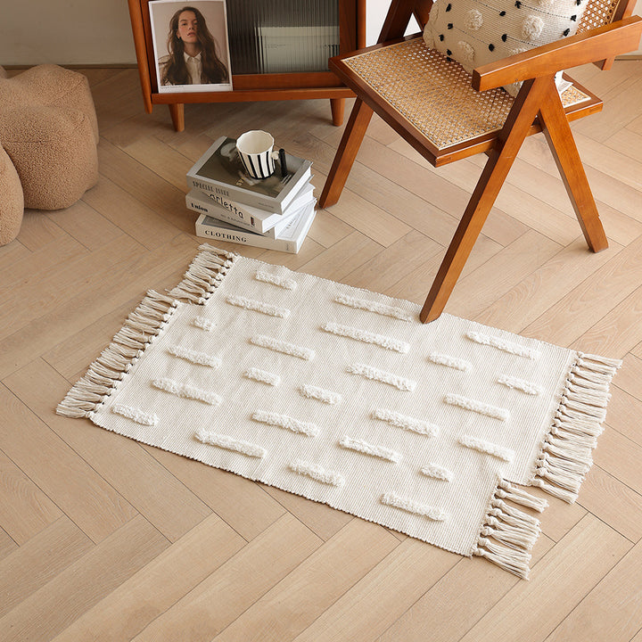handwoven cotton runner with fringe and embossed relief pattern