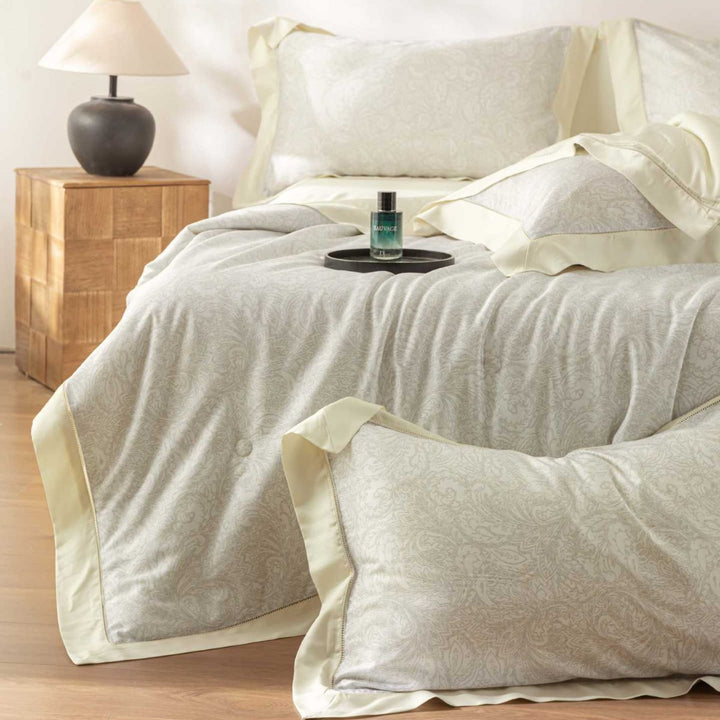 Luxurious cotton satin bedding set with delicate leaf design and hem detail