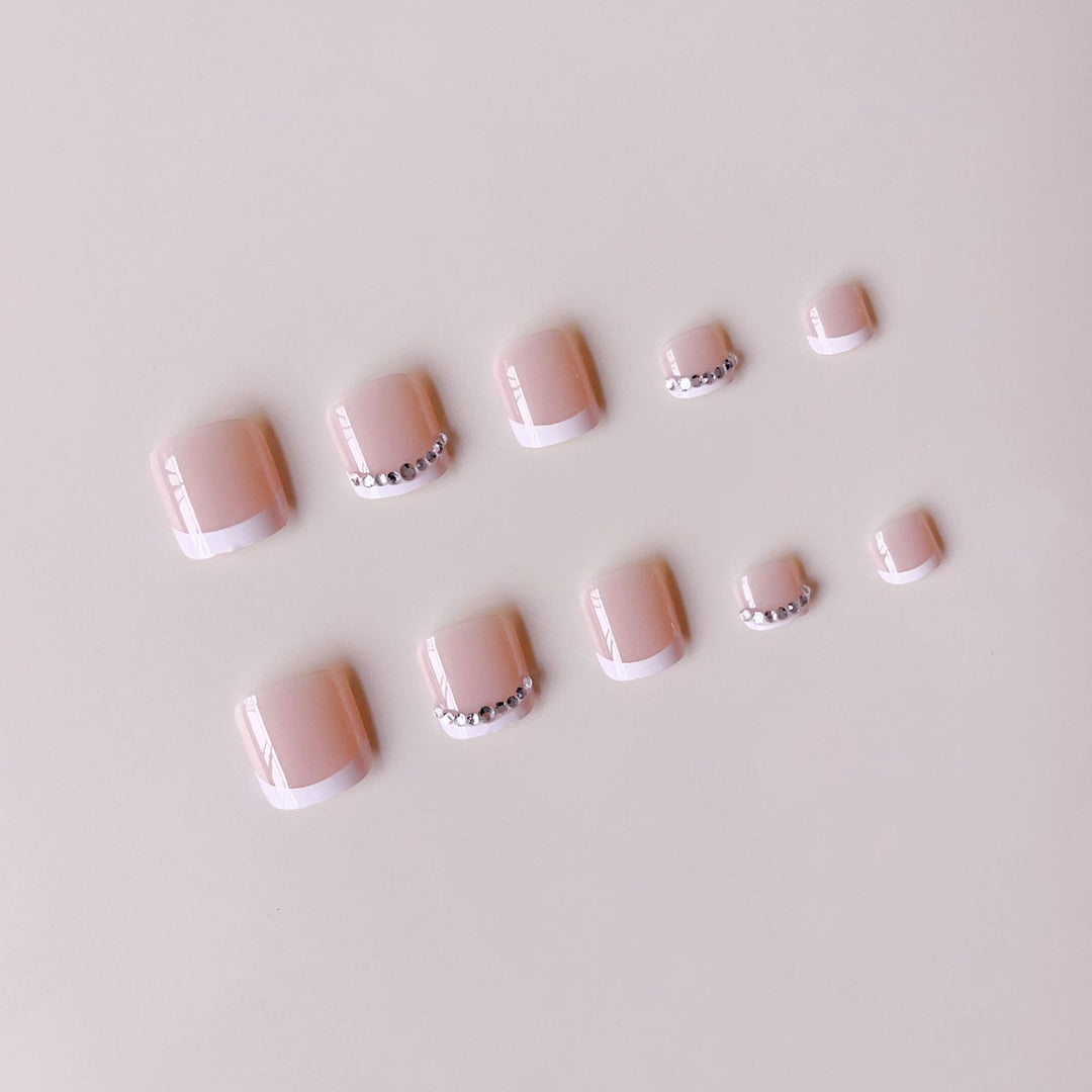 Nail art set with elegant French design and sparkling accents Stornfield