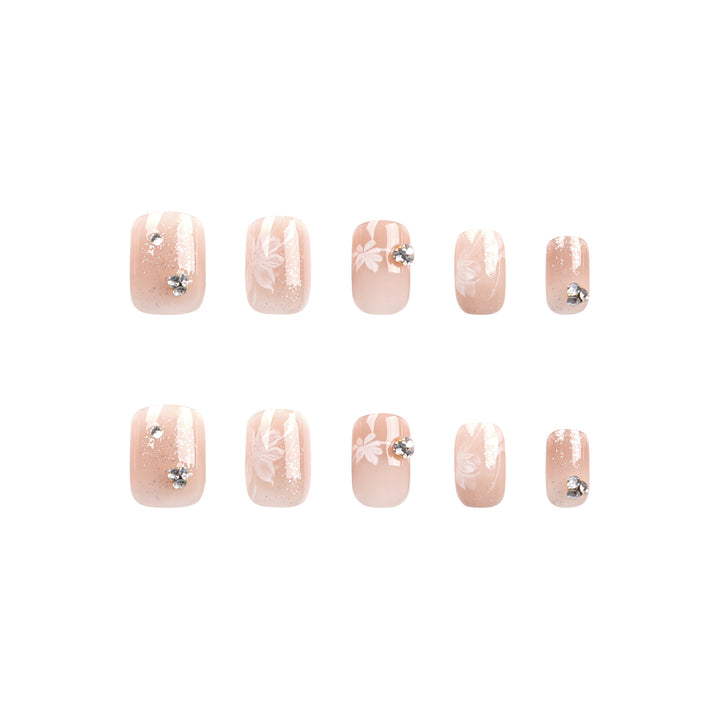 Elegant Nail Art with Holographic Accents and Floral Embellishments Stornfield
