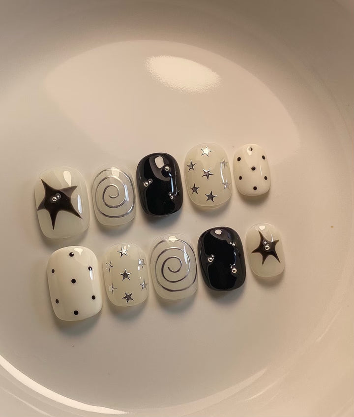 Artistic Press-On Nail Set with Star and Swirl Designs