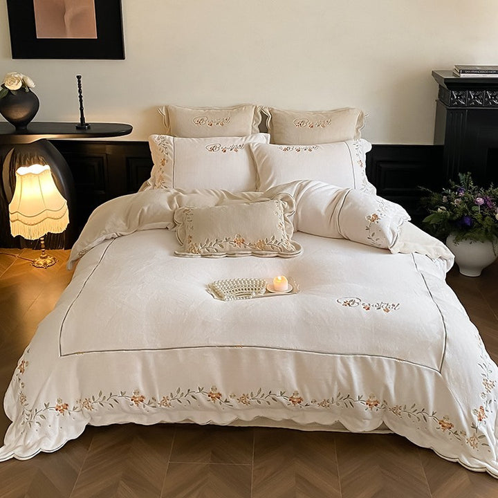 High-quality embroidered bedding set made of cotton percale with ruffled hem and floral relief