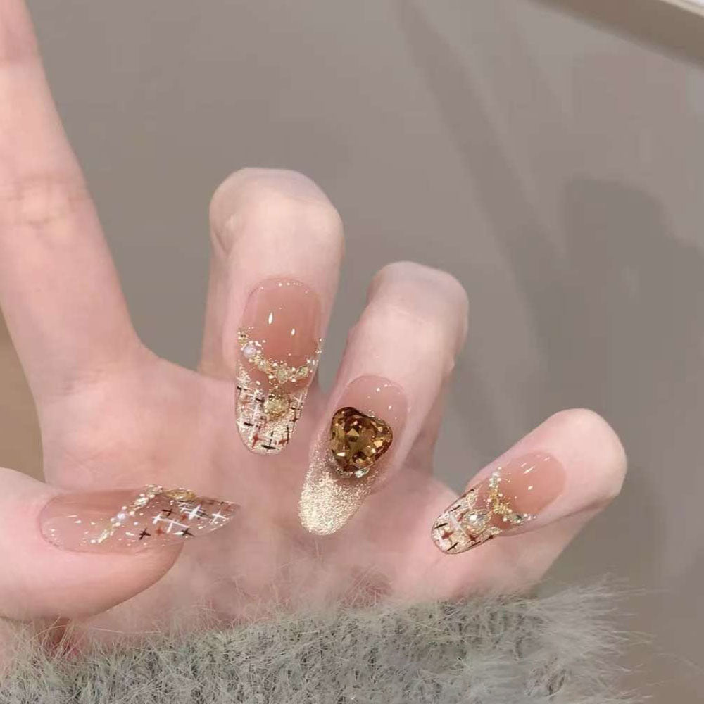 Artificial nails with glamorous rhinestone decorations Stornfield
