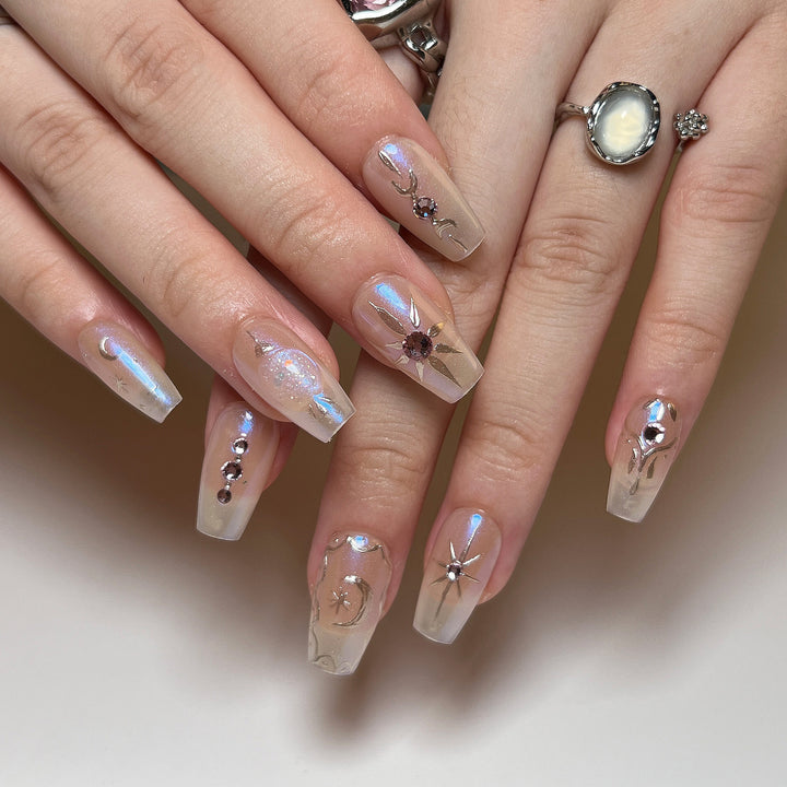 Artificial nail art with elegant rhinestone and glitter effects Stornfield